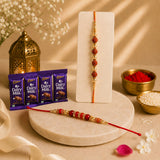 Set Of 2 Pearl And Rudraksha Rakhi With Cadbury Dairy Milk