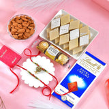 Delightful Rajasthani Rakhi Set Hamper with Kaju Katli, Lindt Extra Creamy Chocolate, Ferrero Rocher & Almond