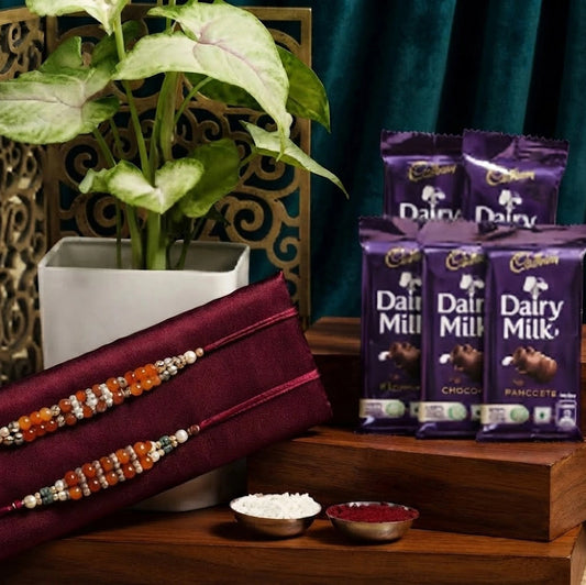 Set Of 2 Rakhi With Chocolate And Syngonium Plant Hamper