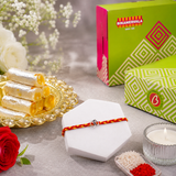 Archies Silver Om Charm Braided Rakhi with Kaju Roll