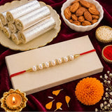 Pearl Rakhi with Kaju Roll & Almonds | Traditional Raksha Bandhan Sweet Hamper