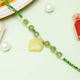 Yellow Leaf Charm Rakhi with Gulab Jamun