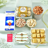 Blissful Rakhi Hamper with Soan Papdi, Ferrero Rocher, Lindt Extra Creamy Chocolate Bar, Almond, Cashew & Pistachio