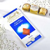Golden Bhai Rakhi Hamper with Almond, Biscoff Biscuit, Kaju Katli, Lindt Excellence Extra Creamy Milk Chocolate & Ferrero Rocher