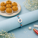 Evil Eye Rhinestone Rakhi with Besan Laddo