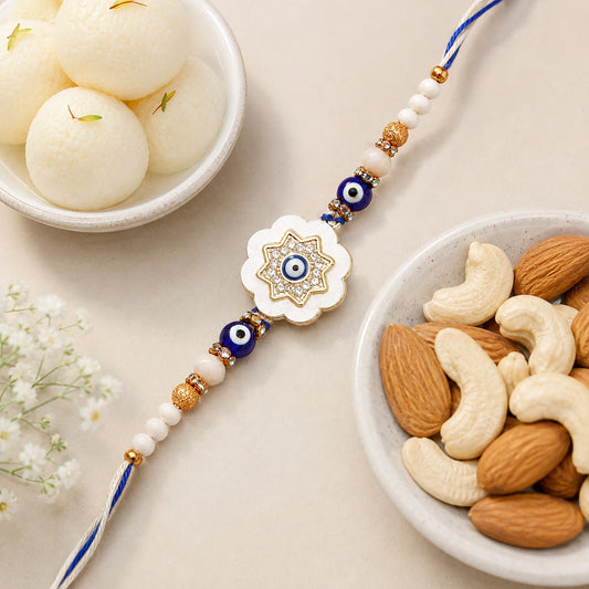 Evil Eye Flower Medallion Rakhi with Rasgulla & Dry Fruits
