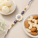 Evil Eye Flower Medallion Rakhi with Rasgulla & Dry Fruits
