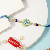 Turquoise Sunburst Evil Eye Rakhi & UXR Royal Life Perfume Mug Set