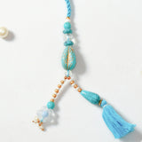 Golden Eye & Turquoise Drop Tassel Rakhi Set