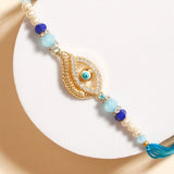 Paisley Evil Eye Charm Rakhi & UXR Royal Life Perfume Mug Set