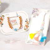 Wooden Evil Eye Bracelet Rakhi & Pastel Tri-Tassel Lumba Rakhi Set