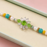 Traditional Green Stone Rakhi With Gems For Brother