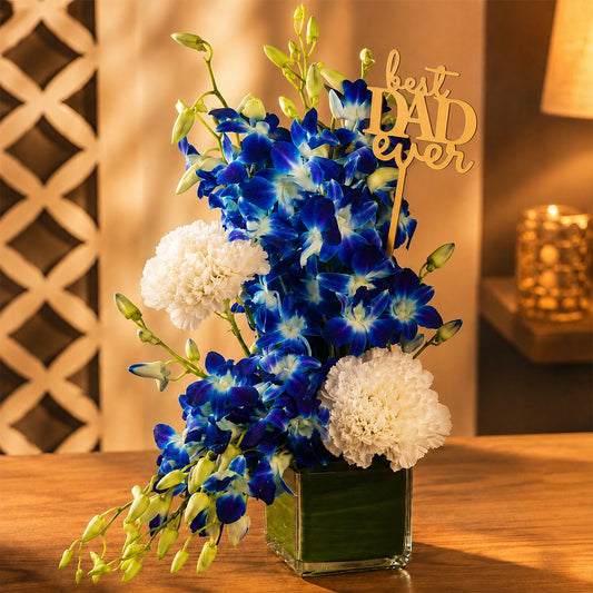 White Carnation & Blue Orchid Square Vase Arrangement
