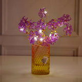 Purple Blossoms in Crystal Vase