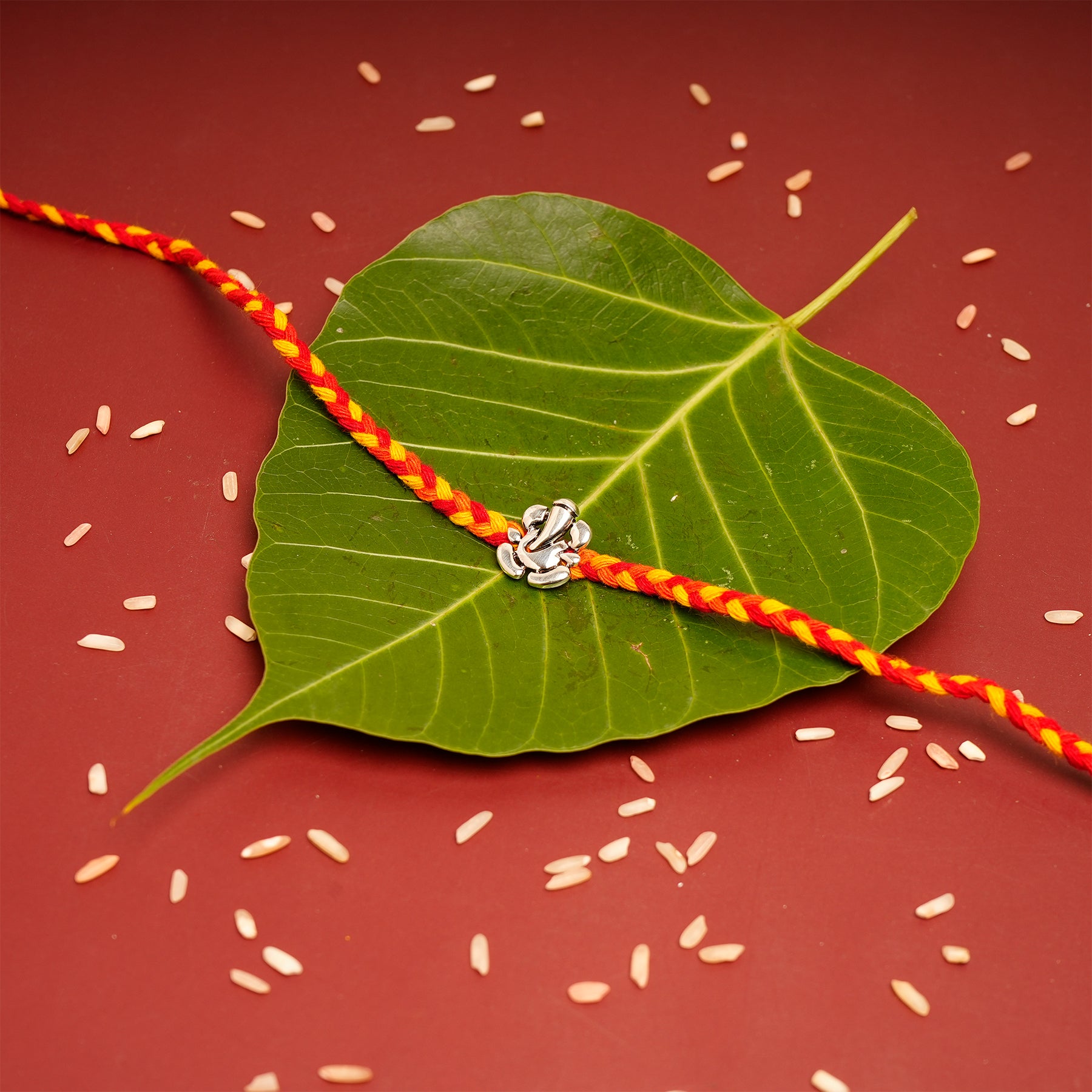 Divine Ganesha Premium Silver Rakhi