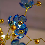 Blue Blossoms in Crystal Vase