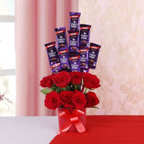 Glass Vase Arrangement Of 8 Red Roses And 10 Dairy Milk Chocolates (13Gms Each)