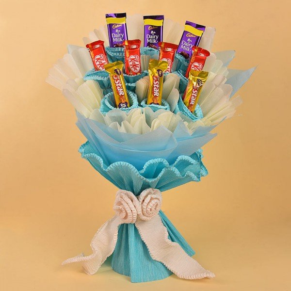 Bouquet Of Chocolates In Blue And White Paper Packing