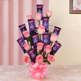 Glass Vase Arrangement Of 12 Pink Roses And 10 Dairy Milk Chocolates (13Gms Each)