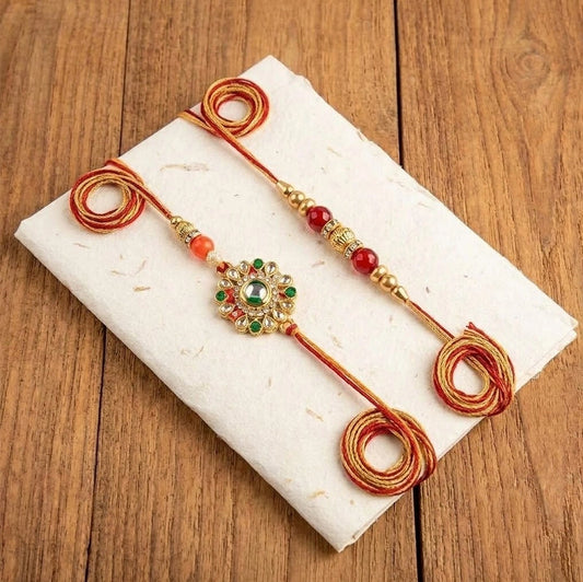 Set Of 4 Kundan Rakhi With Dry Fruits Potli