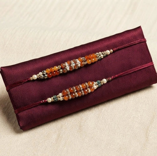 Set Of 2 Rakhi With Chocolate And Syngonium Plant Hamper