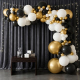 Black Sequin Wall with Gold & Black Balloon Decor