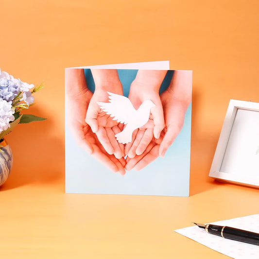 Pack of 50 Dove in Hands Greeting Card