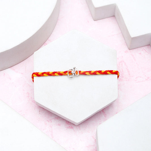 Archies Silver Om Charm Braided Rakhi with Kaju Roll and Dry Fruits