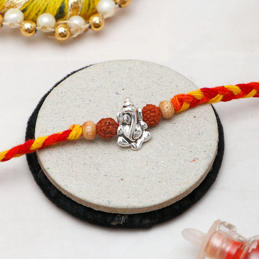 Archies Silver Ganesha Rudraksha Rakhi with Rasgulla and Dry Fruits