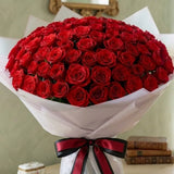 Grand 100 Red Roses Bouquet in White Premium Paper