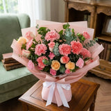 14 Light Pink Carnations & 8 Roses Bouquet with Eucalyptus in Pink Paper