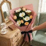 5 White Gerberas & 5 Peach Roses Bouquet in Peach Wrap with Black Ribbon