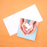 Pack of 50 Dove in Hands Greeting Card
