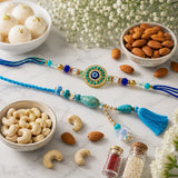 Evil Eye Sun Medallion Bhaiya Bhabhi Rakhi Set with Rasgulla & Dry Fruits