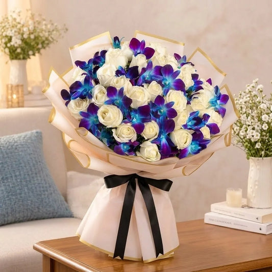 26 White Roses & 4 Blue Orchids Bouquet in Pink Wrap with Black Ribbon