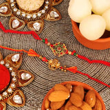 Designer and Ganesha Rakhi with Tin Rasgulla and Almonds Set of 2