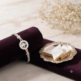 Floral Medallion Silver Rakhi with Kaju Katli