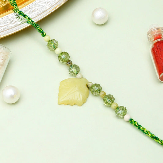 Yellow Leaf Charm Rakhi with Gulab Jamun