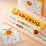 Om and Peacock Rakhis with Toblerone