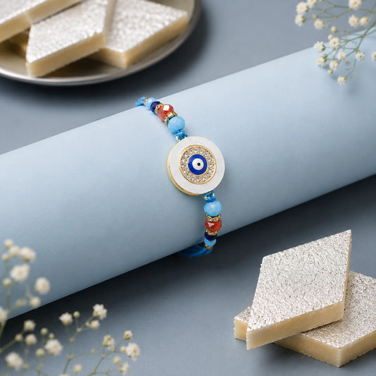Evil Eye Round Charm Rakhi with Kaju Katli