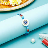 Evil Eye Round Charm Rakhi with Kaju Katli