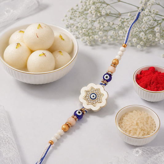 Evil Eye Star Flower Rakhi with Rasgulla