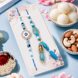 Studded Evil Eye Bhaiya Bhabhi Rakhi Set with Rasgulla & Dry Fruits