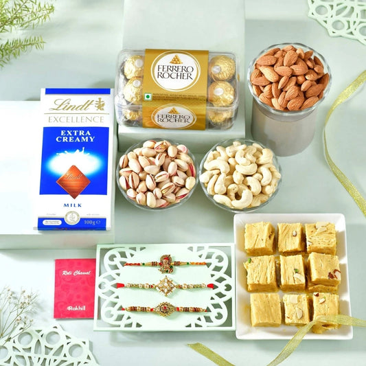 Blissful Rakhi Hamper with Soan Papdi, Ferrero Rocher, Lindt Extra Creamy Chocolate Bar, Almond, Cashew & Pistachio
