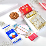 Golden Bhai Rakhi Hamper with Almond, Biscoff Biscuit, Kaju Katli, Lindt Excellence Extra Creamy Milk Chocolate & Ferrero Rocher