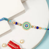 Evil Eye Sunburst Rakhi with Dry Fruits