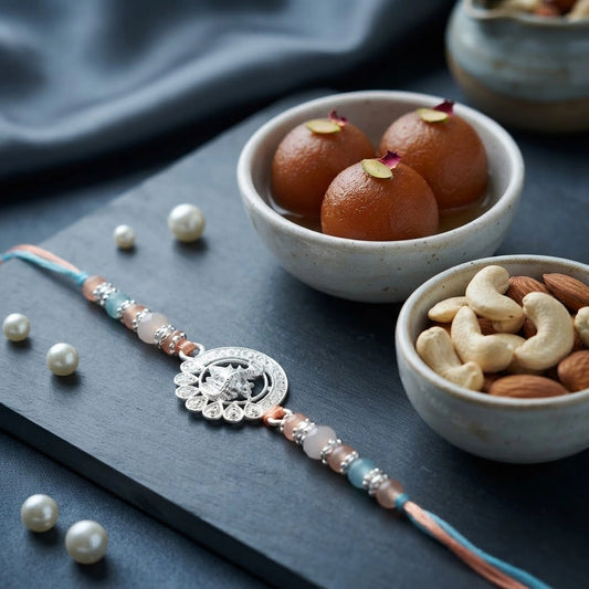 Silver Peacock Medallion Rakhi with Gulab Jamun & Dry Fruits