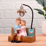 Couch Couple Illuminating Showpiece