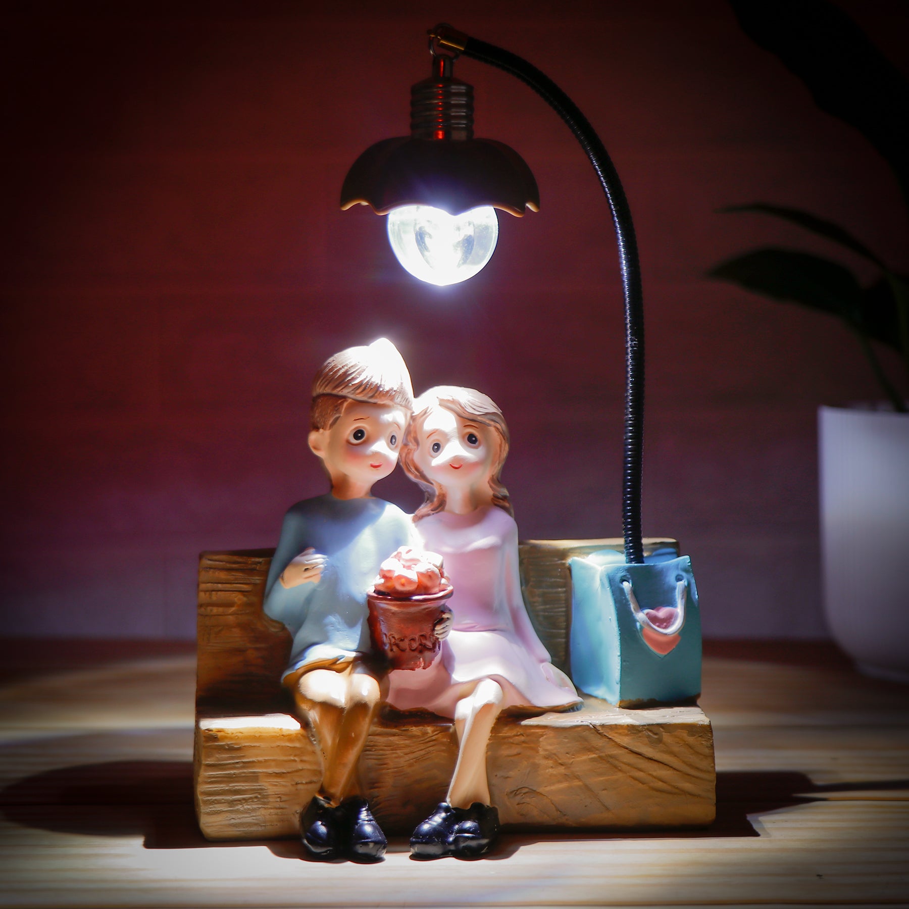 Couch Couple Illuminating Showpiece