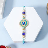 Turquoise Sunburst Evil Eye Designer Rakhi & UXR Royal Life Perfume Gift Set